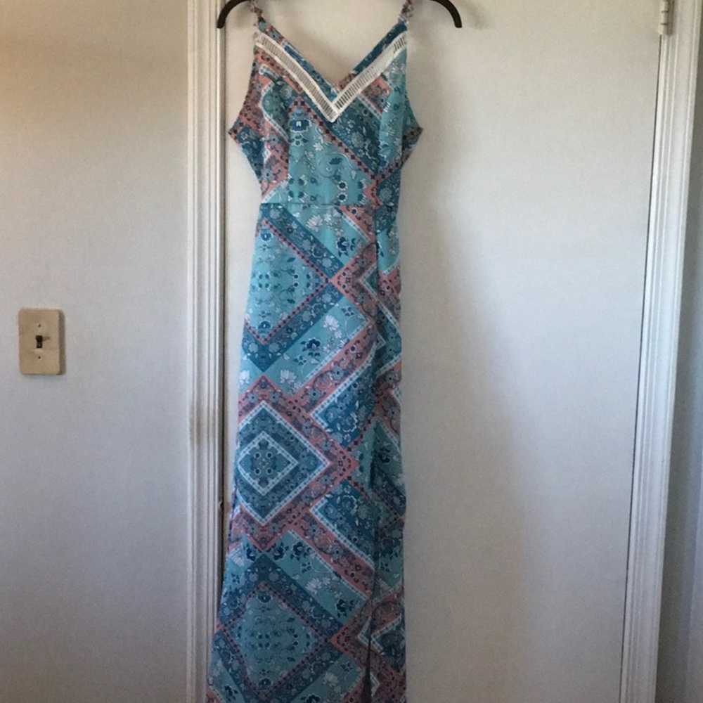 Never worn Maxi with cut out back and slit on the side. No tags